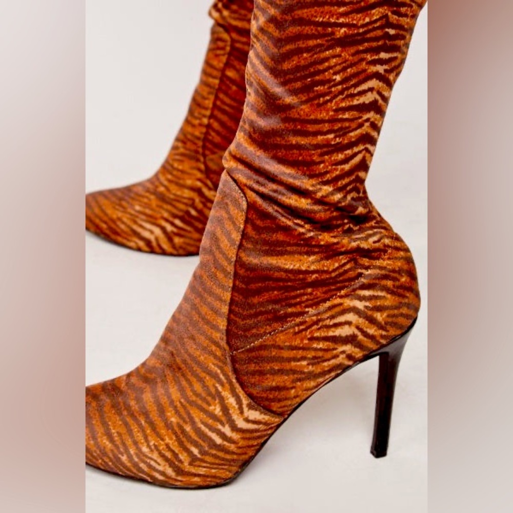 Thigh high brown zebra print boots